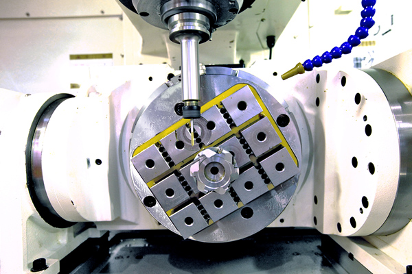 Techniks circular workholding magnet holding metal part in 5-axis cnc center